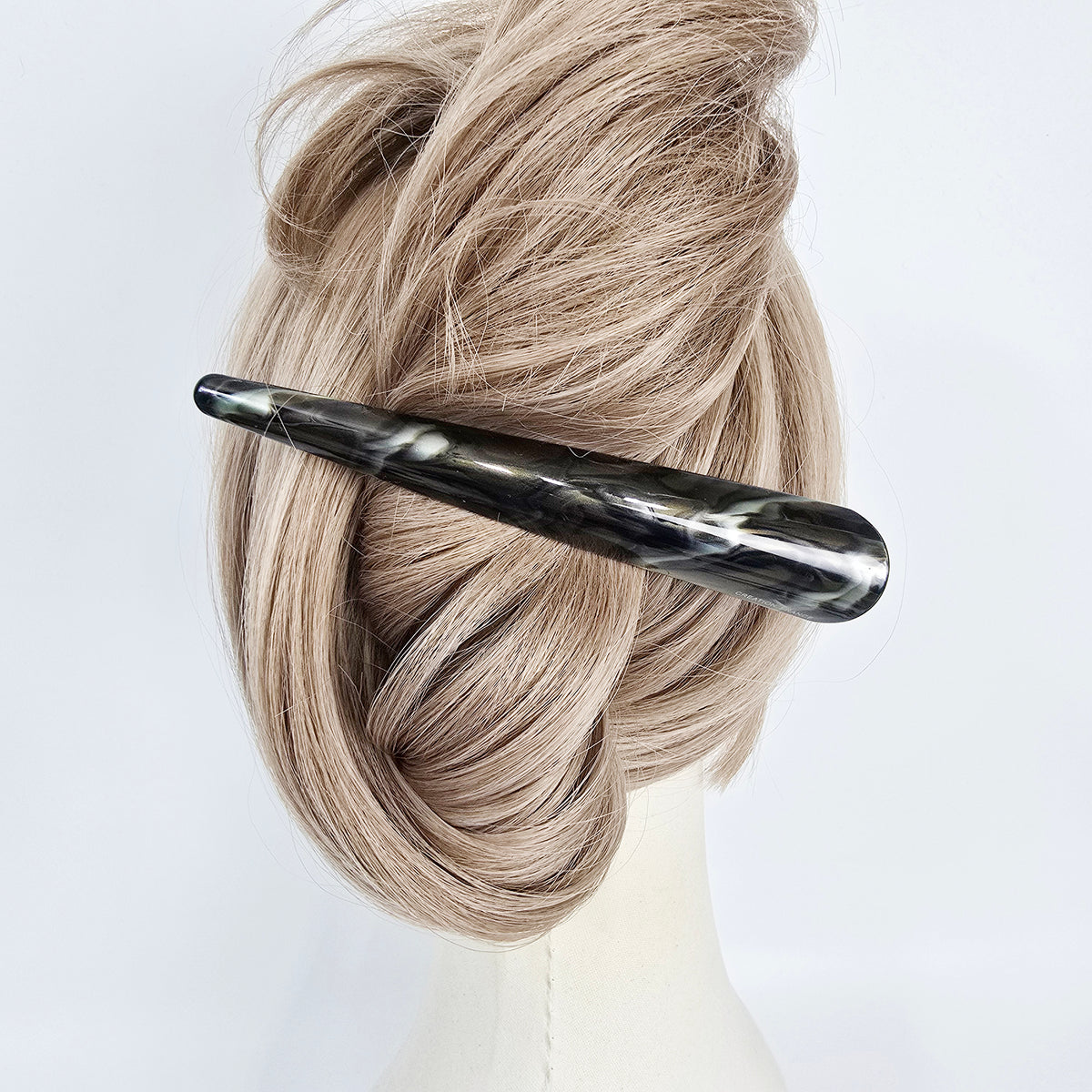 7 Khaki Brown alligator clip in an updo on a mannequin