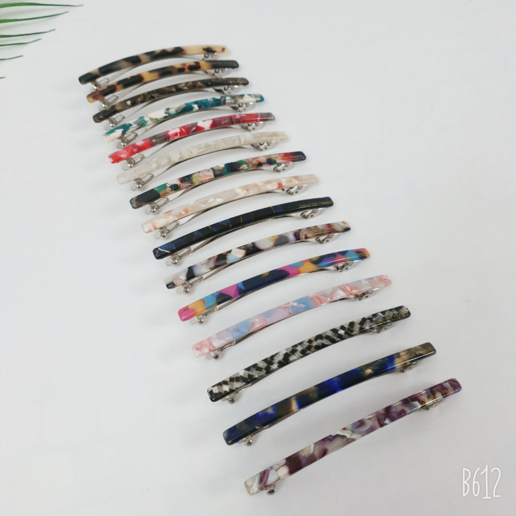 Slim cellulose acetate hair barrette in tortoise shell and marble patterns. Long skinny automatic hair clip for ponytails and half up styles.