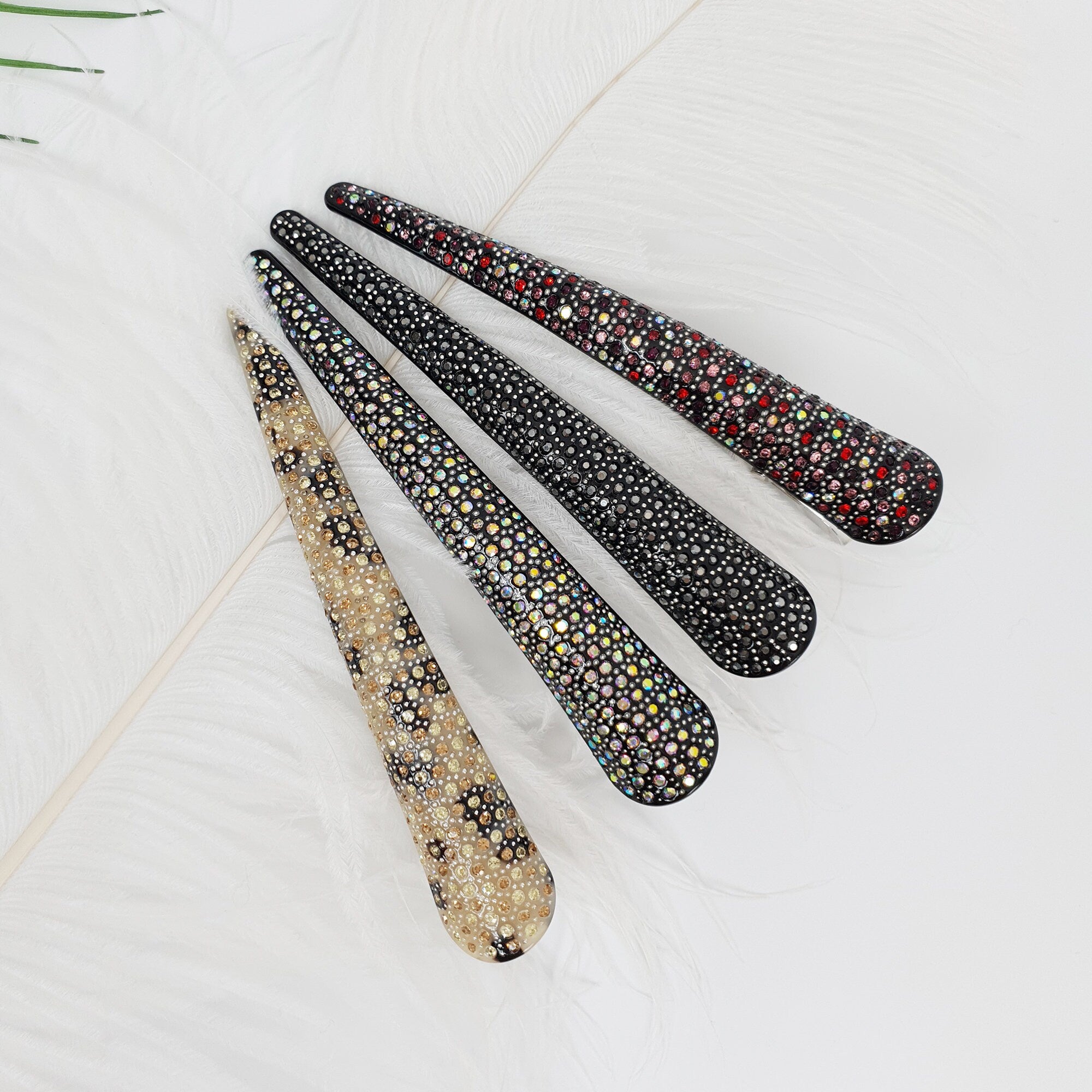 Cellulose acetate long alligator clip with rhinestone crystals. 5.5 inch beak clip in leopard and black patterns for updos and thick hair.