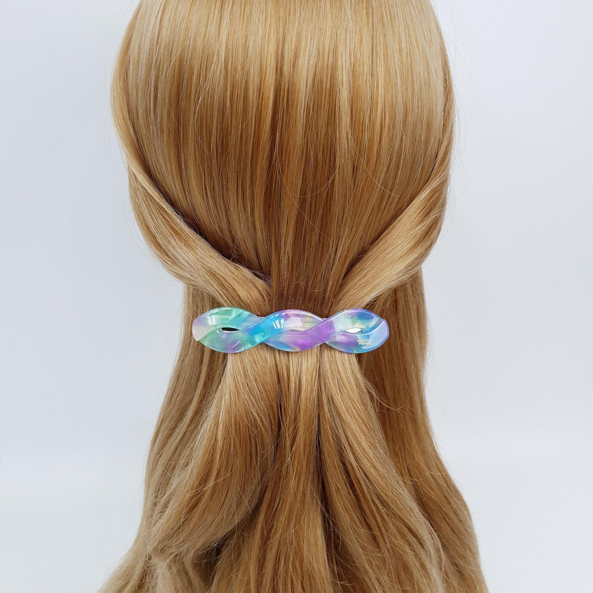 Cellulose acetate twisted barrette in tortoise and marble patterns. 3.7 inch automatic clip for half up styles and fine hair.