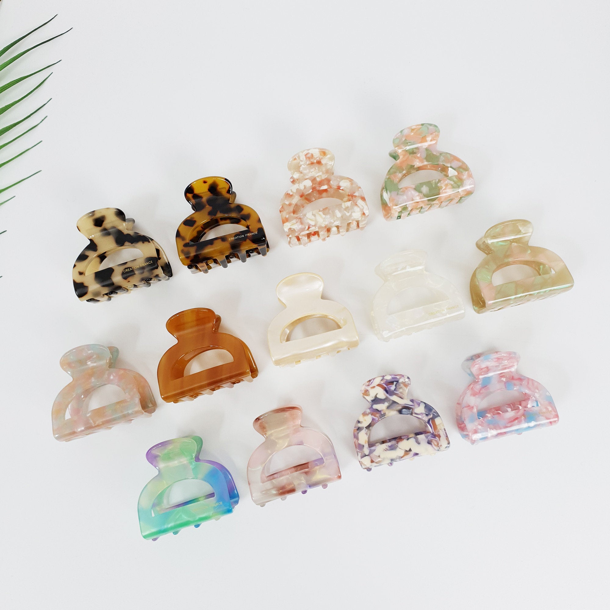 Cellulose acetate arch shaped hair claw clip in tortoise shell and marble patterns for half up hairstyles. Small semi circle jaw clip for women.