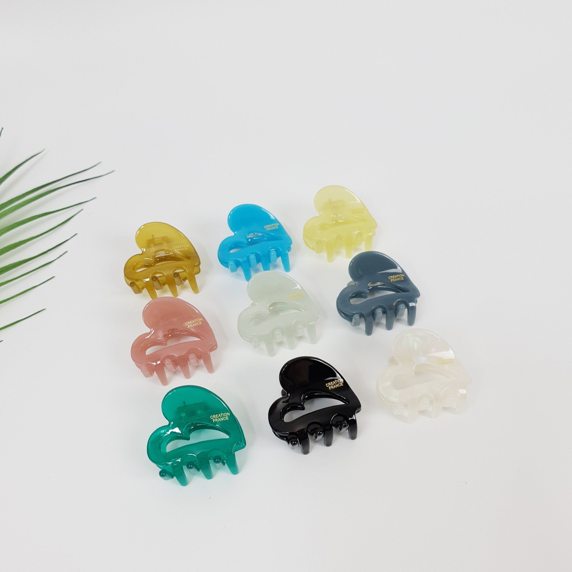 Small heart shaped hair claw clip in glossy solid colors. Mini cellulose acetate heart jaw clip for side hair styling.