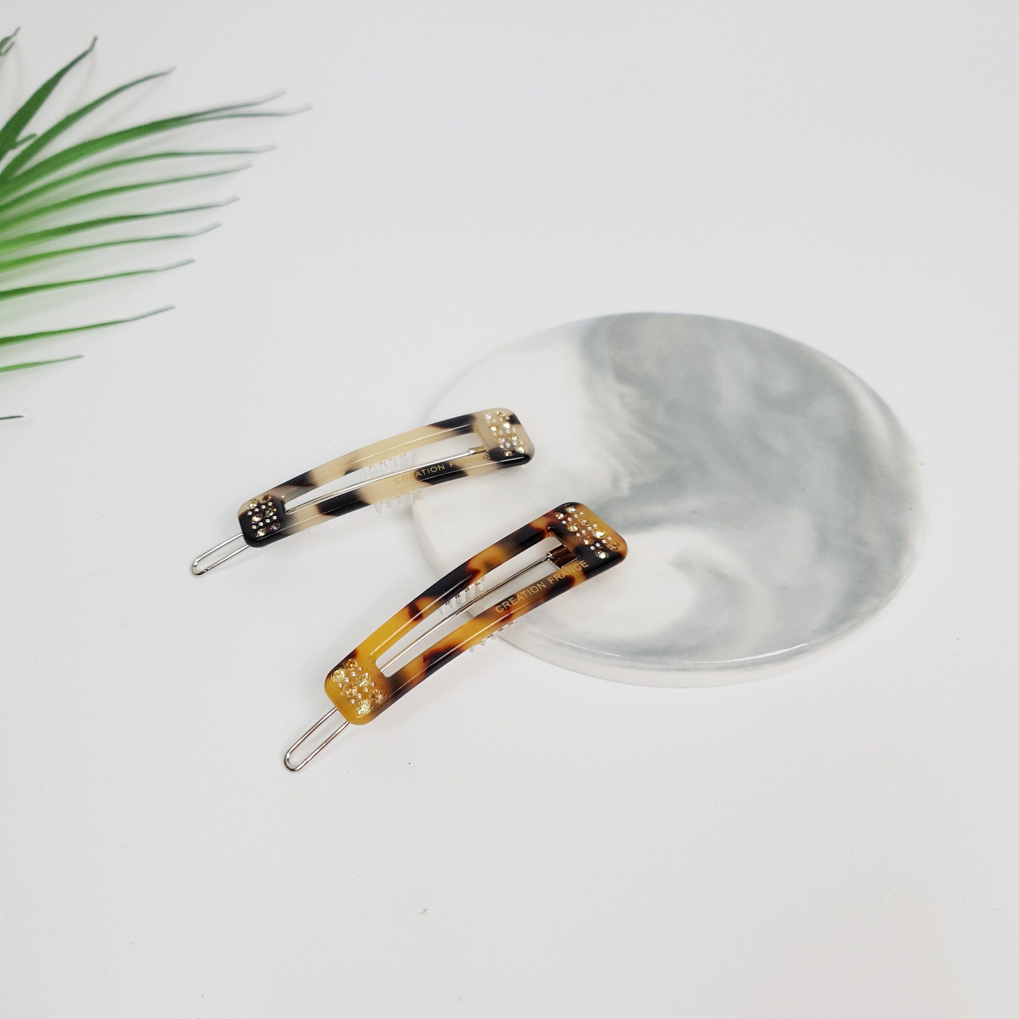 Tortoise shell rectangle snap hair clip with rhinestone accents. Small cellulose acetate geometric barrette for side bangs.