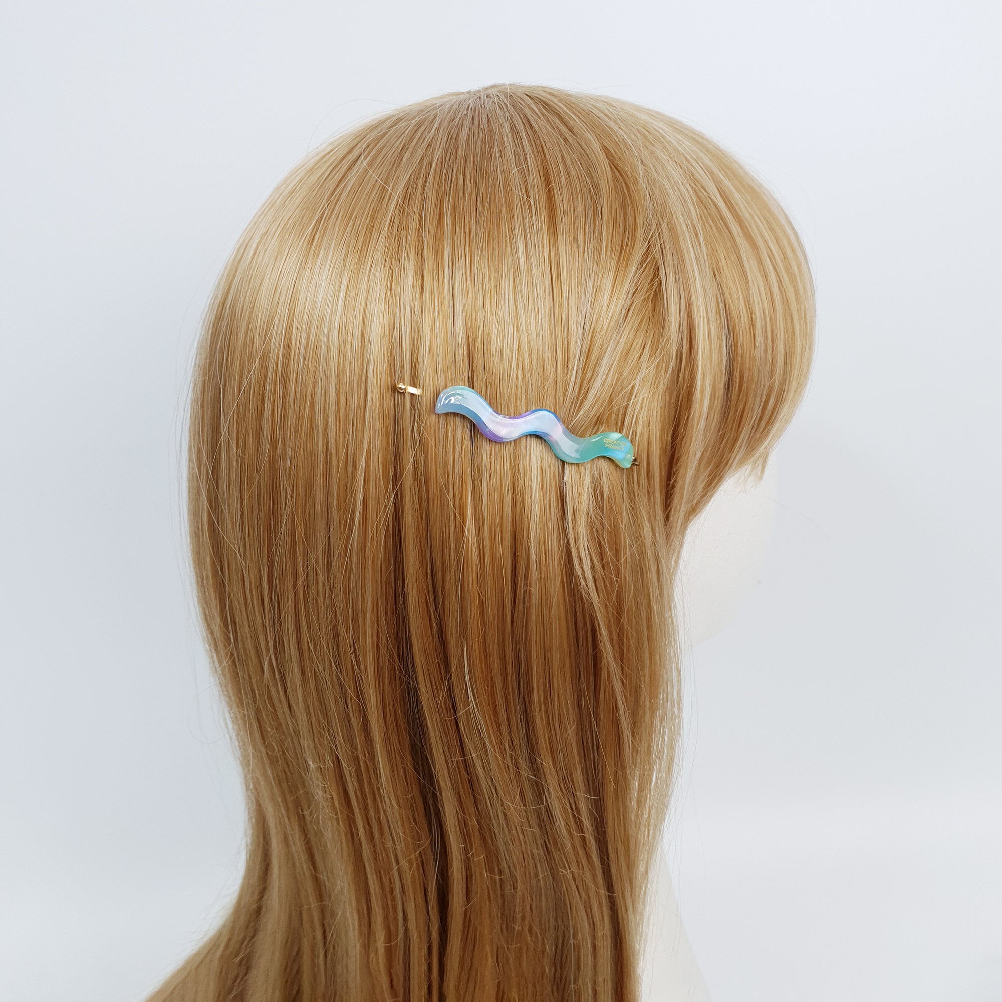 Wavy cellulose acetate hair slide on gold metal base. 2.4 inch squiggle bobby pin for bangs in tortoise shell and pastel colors. Minimalist side hair clip for women.