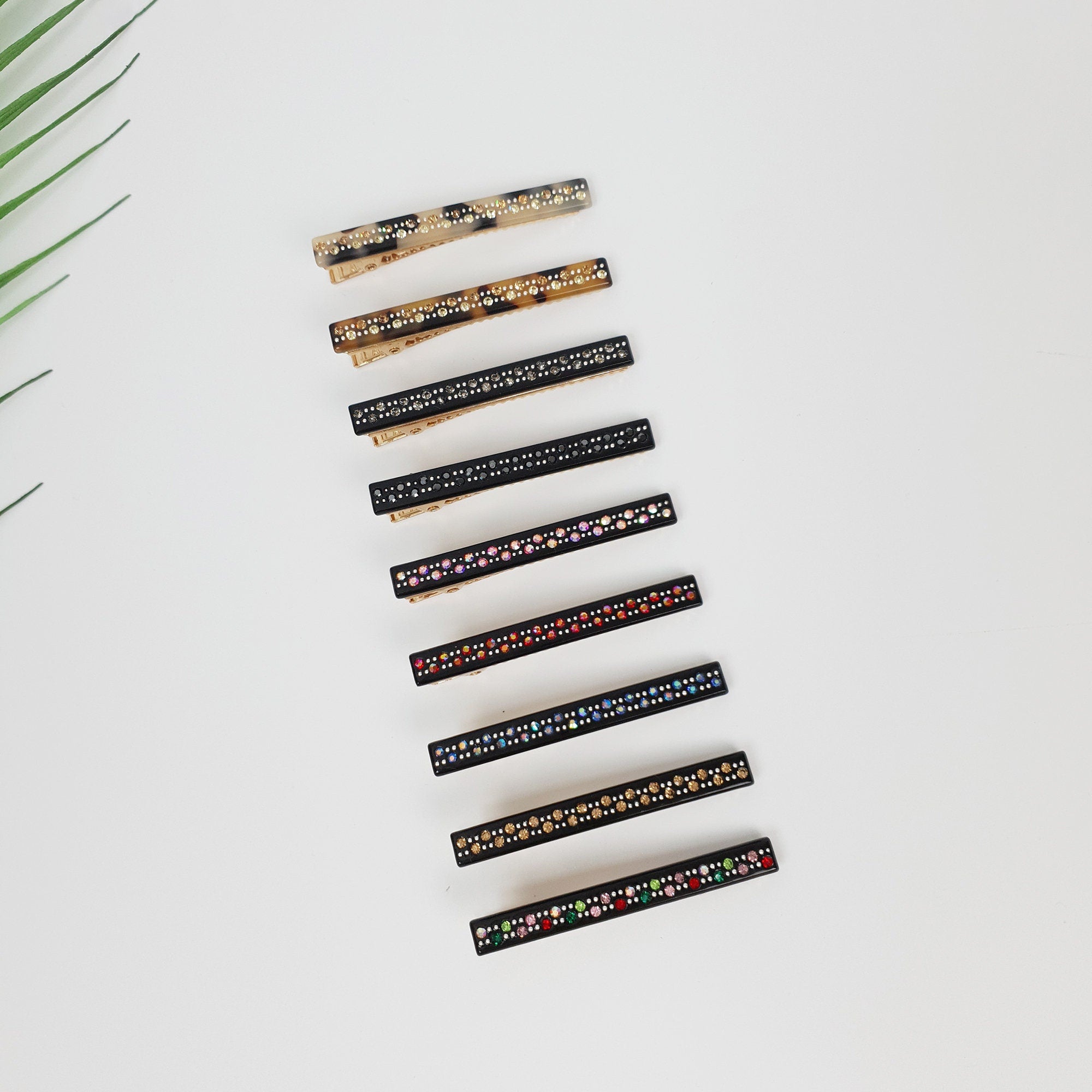 Cellulose acetate slim bar hair clip with sparkling rhinestone embellishments. 2.4 inch alligator beak clip in tortoise and black for styling bangs.