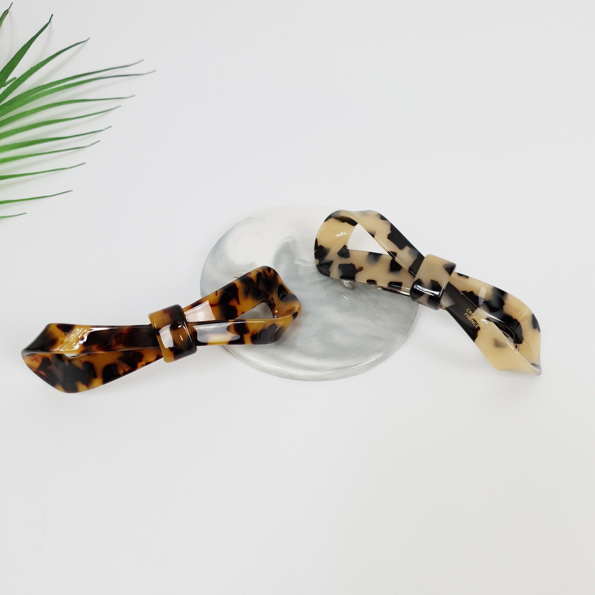 Cellulose acetate tortoise shell twisted ribbon barrette. 4.1 inch large automatic hair clip for ponytails and half-up styles.