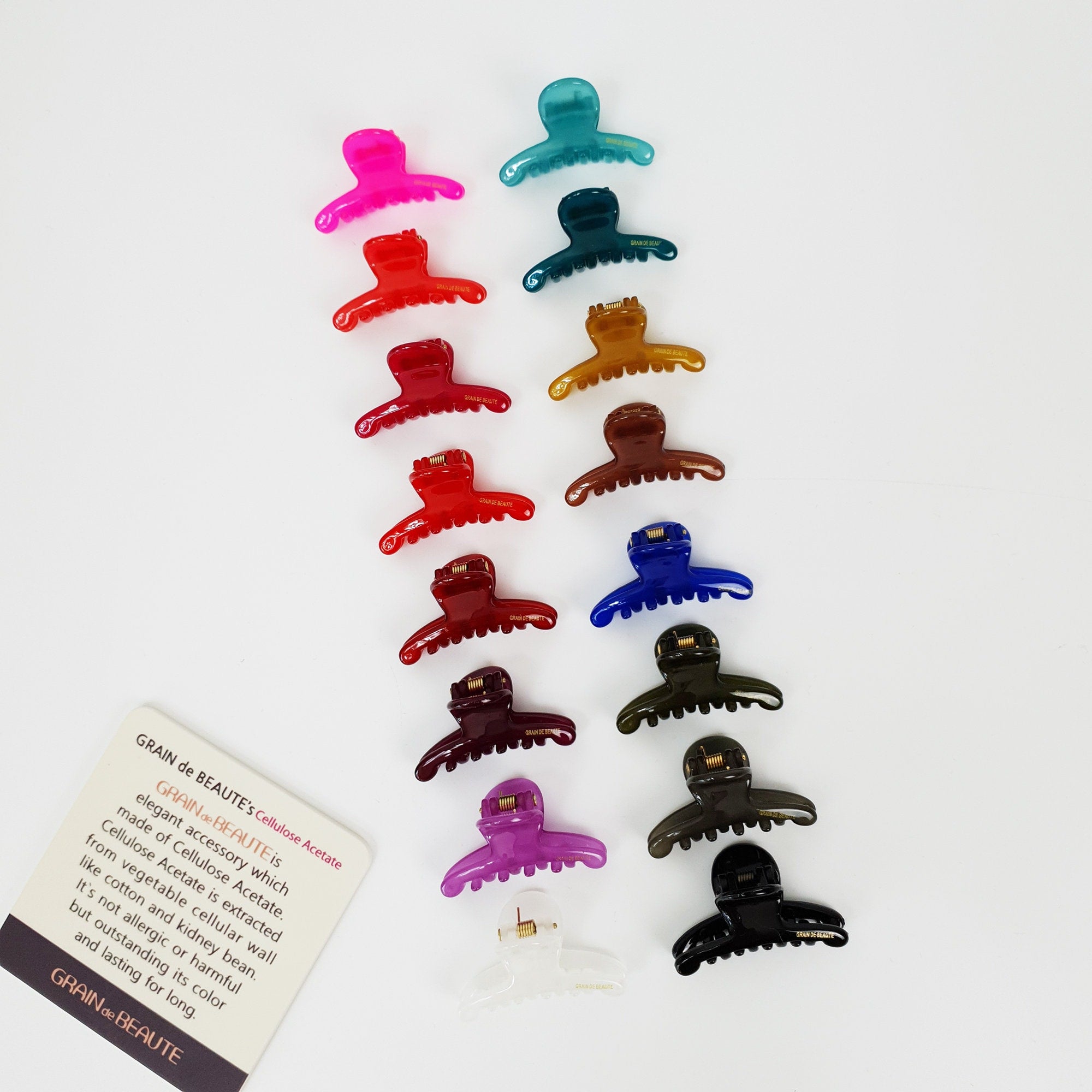 Small cellulose acetate hair claw clip in vibrant solid colors, glossy mini jaw clip for bangs and side hair, cute hair accessory for women and girls.