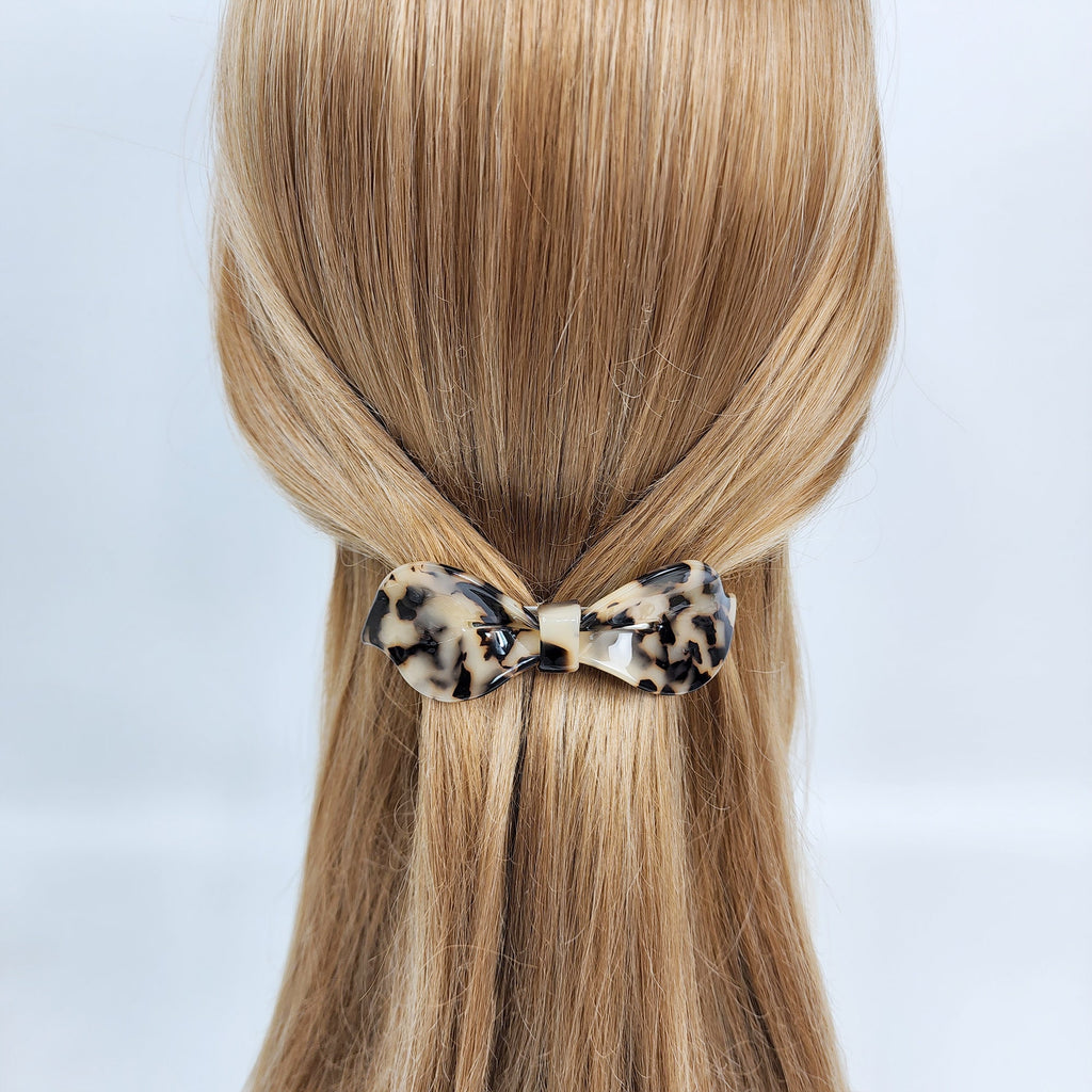 Curved cellulose acetate hair barrette in tortoise shell pattern. 3.7 inch classic bow shape automatic hair clip. Elegant half updo accessory for women.