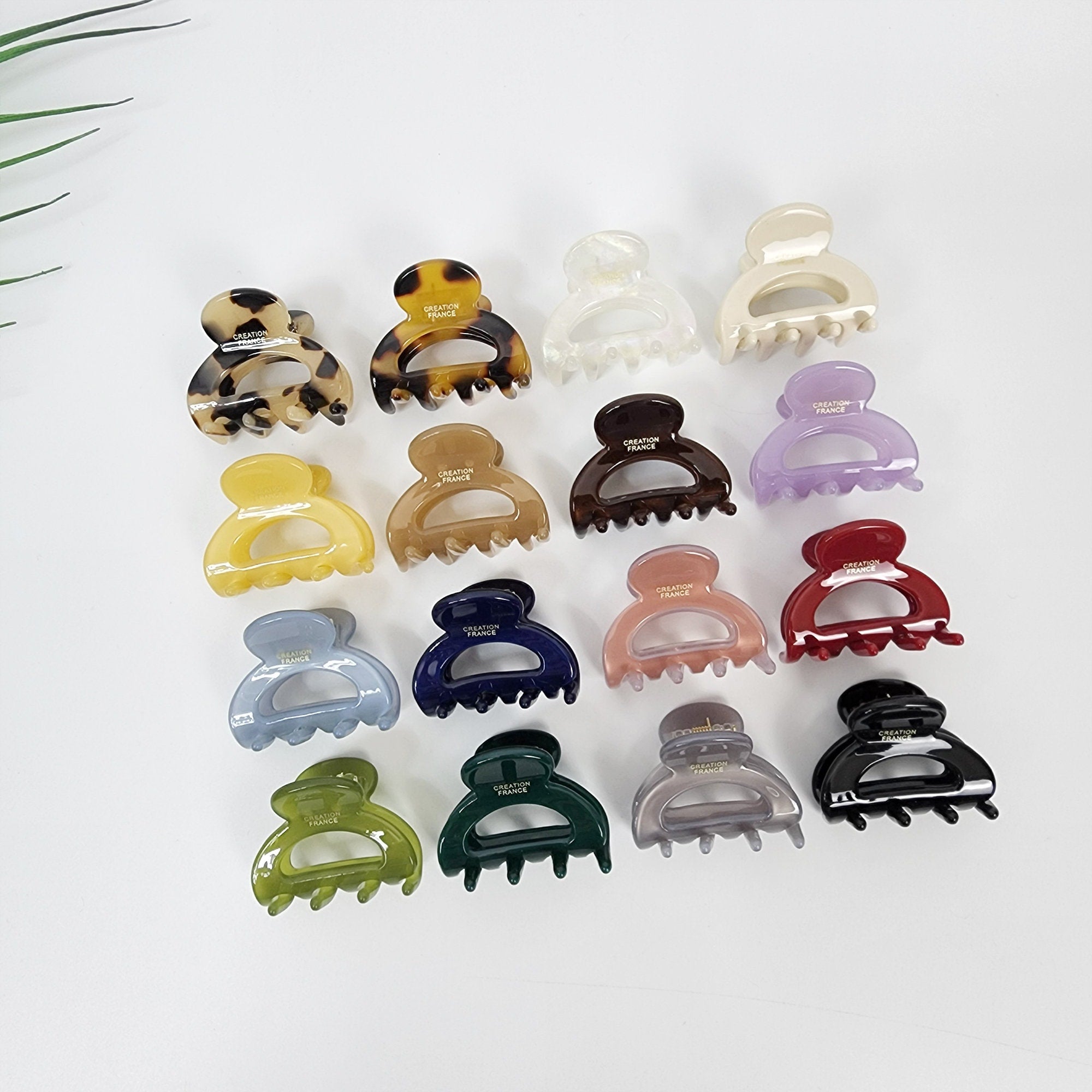Cellulose acetate mini hair claw clip in tortoise shell and solid colors, small arched jaw clip for half up hairstyles, cute Korean hair accessories for women.