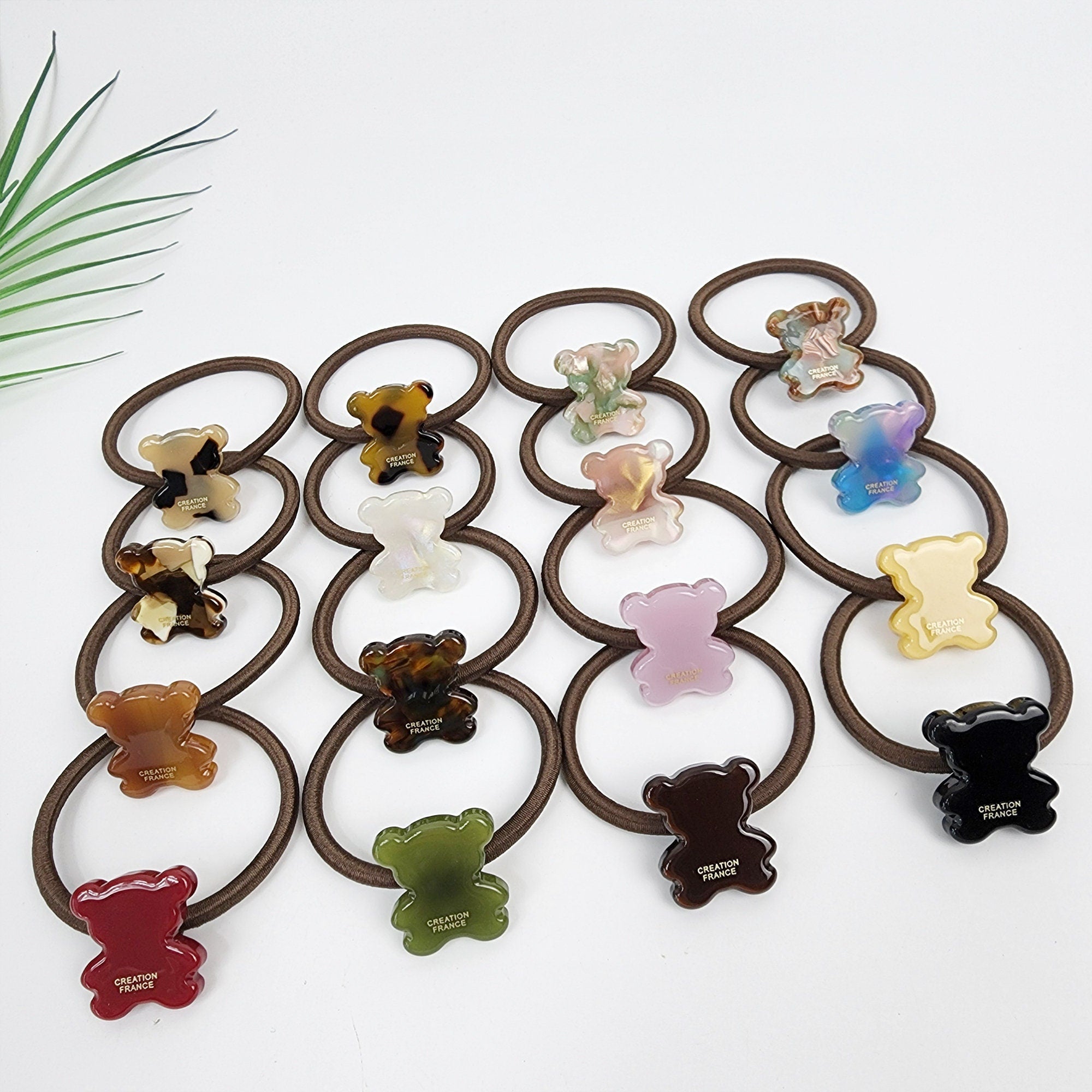 Glossy cellulose acetate teddy bear hair tie in tortoise shell and pastel. Small 0.9 inch animal charm ponytail holder. Cute preppy Korean fashion accessory for girls birthday gift.