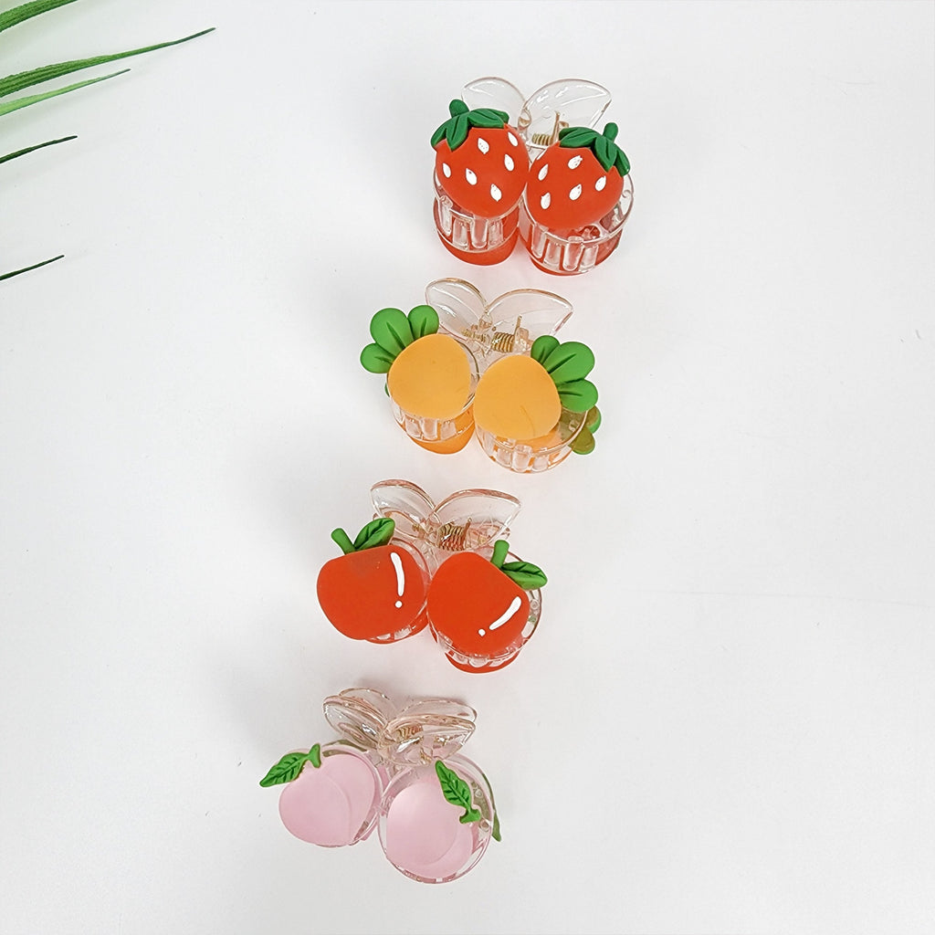 Transparent mini hair claw clip with colorful fruit charms strawberry carrot apple peach for playful summer hairstyles.  Four sets of fruit-shaped hair clips. The first set is red strawberries, the second set is orange peaches, the third set is red apples, and the fourth set is pink peaches.