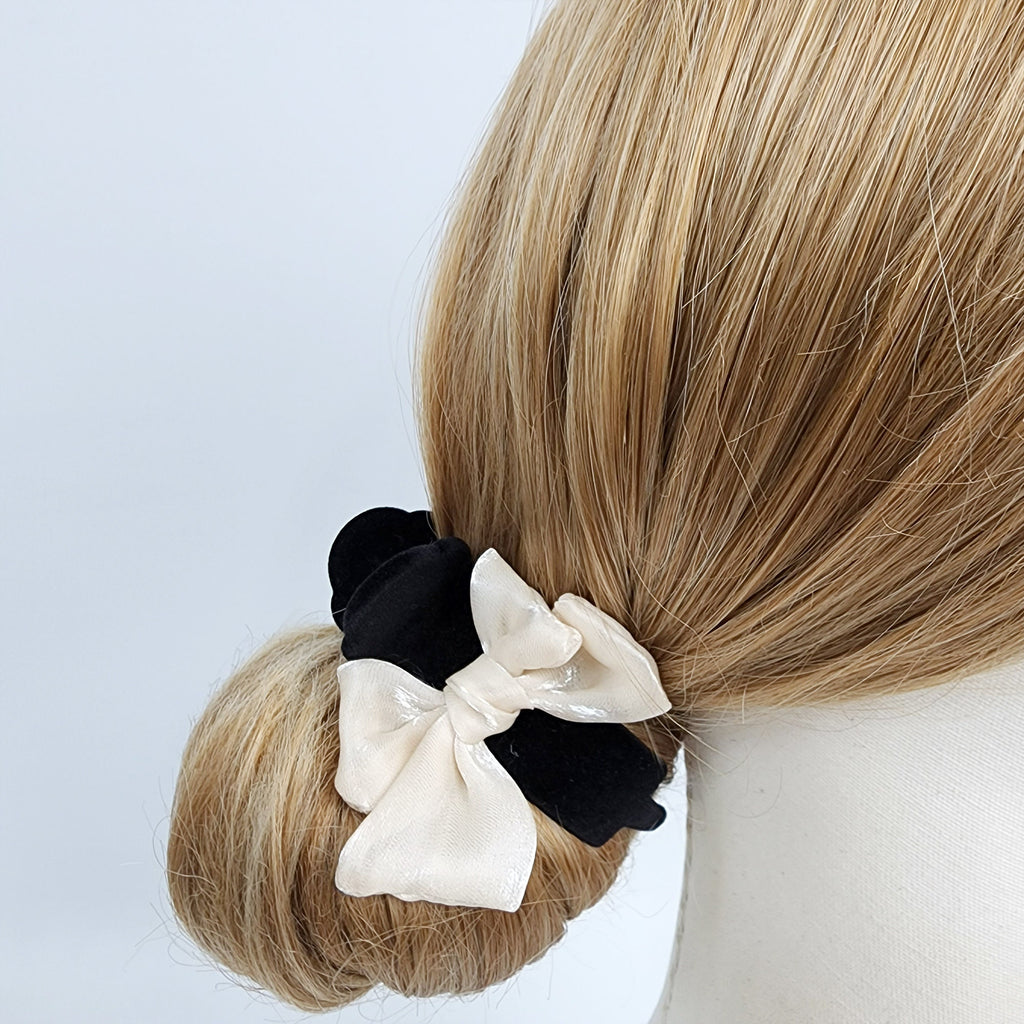Black velvet circular hair claw clip with cream organza ribbon bow, ponytail holder for low bun updo styling.