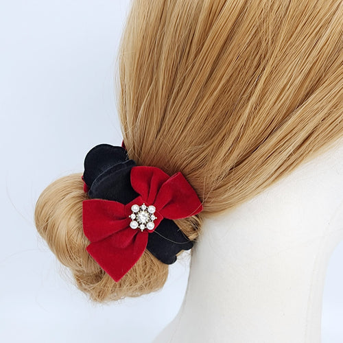 Velvet ribbon bun claw clip in black and red, round ponytail holder with pearl center option for Christmas and winter low bun styling. A black and red hair scrunchie with a rhinestone embellishment