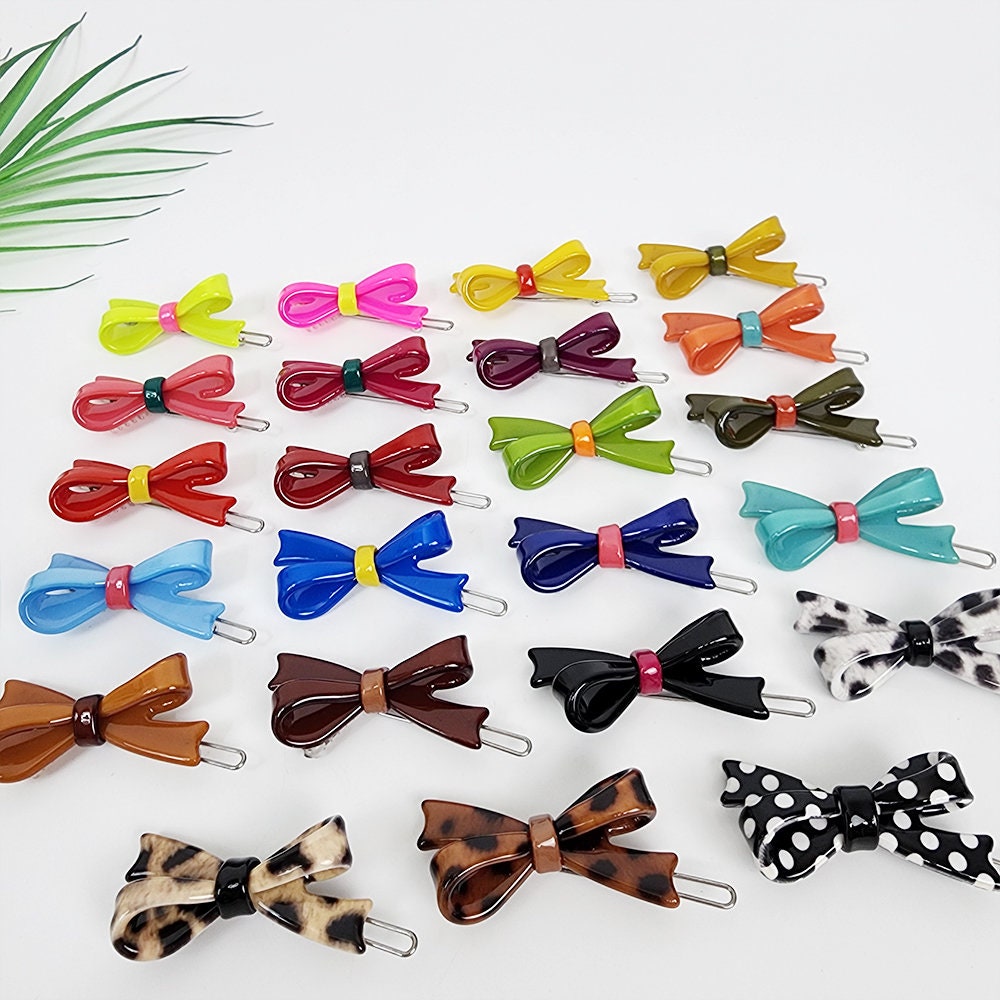 Small cellulose acetate double bow snap hair clips in vibrant colors and tortoise shell pattern, featuring a 1.8 inch size perfect for bangs and side hair styling.