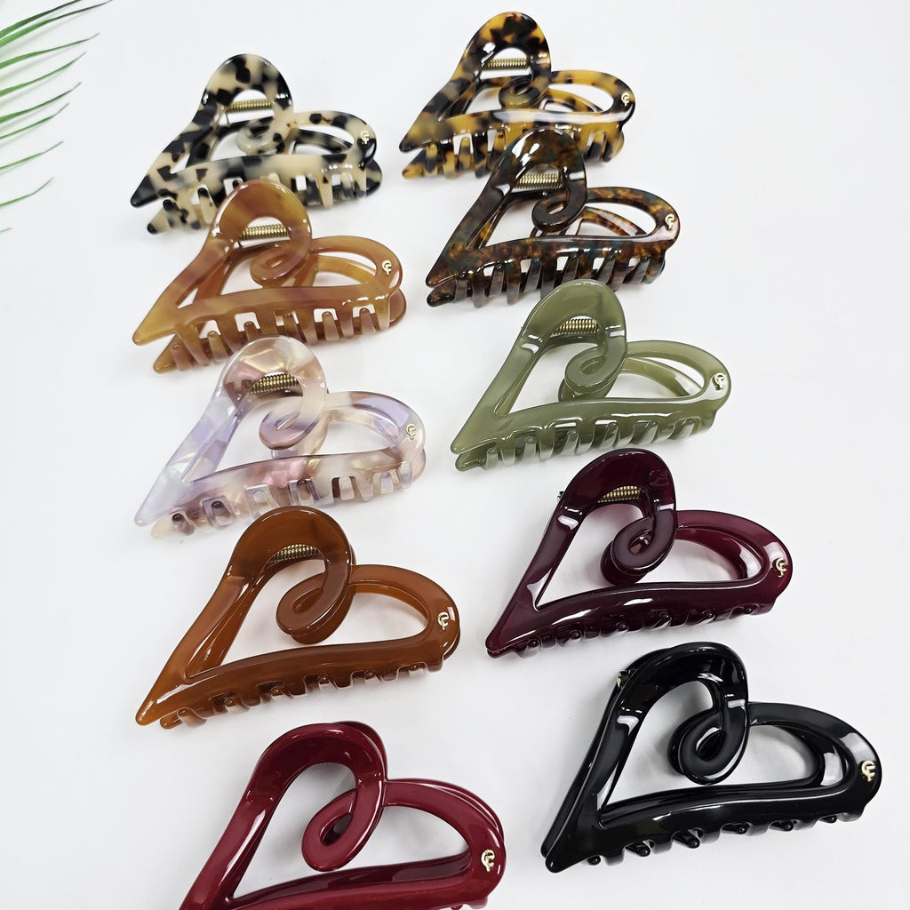Cellulose acetate heart shaped hair claw clip in tortoise shell and solid red colors. 3.5 inch medium jaw clip for half up hairstyles.