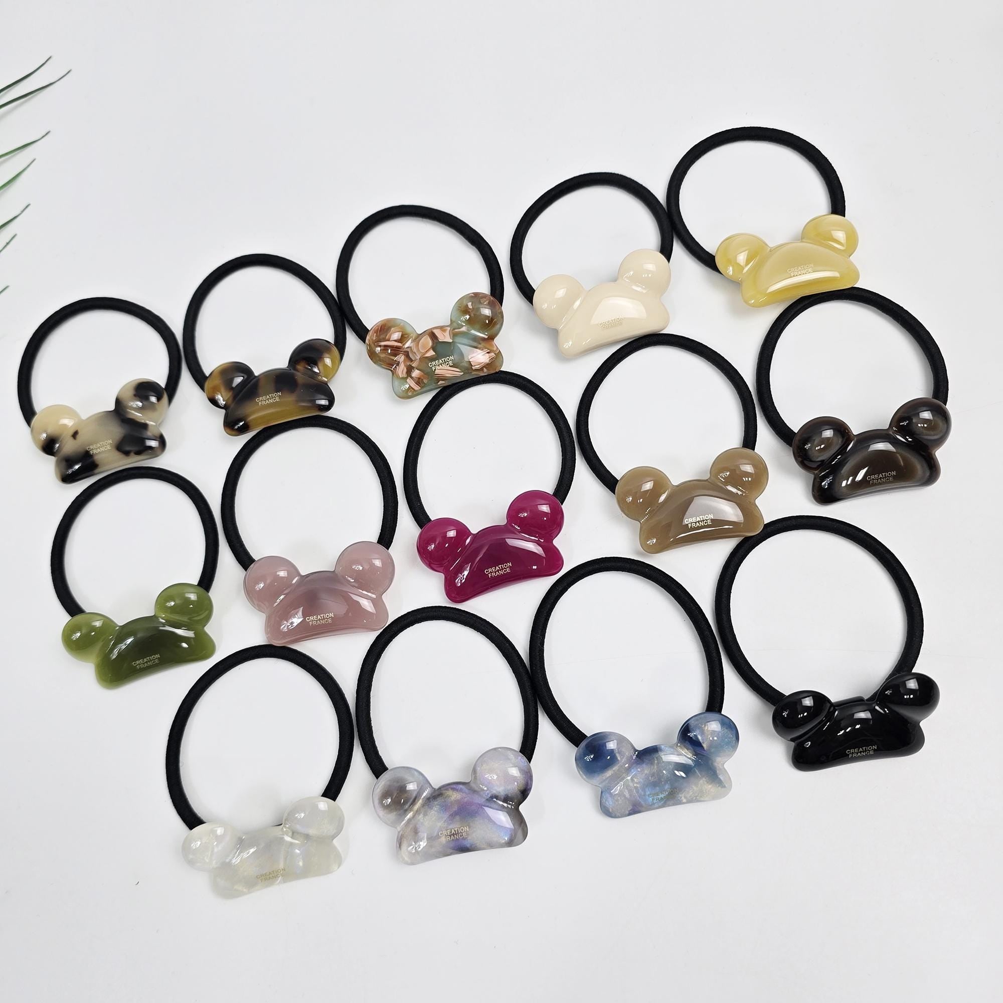 Cellulose acetate mouse shaped hair tie with glossy finish, durable elastic band, cute animal accessory for girls and women ponytail holder.