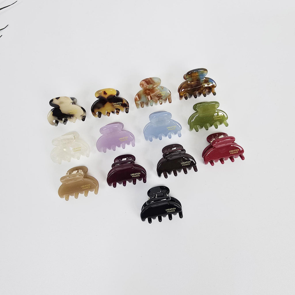Cellulose acetate mini claw clips in tortoise shell and pastel colors for half up hairstyle and bangs.